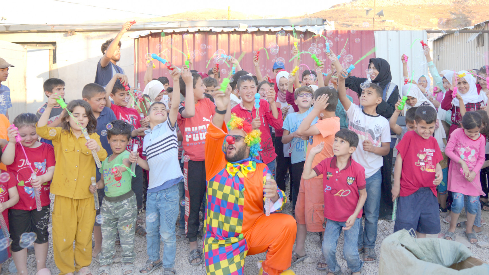 A group of Syrian refugee children enjoy an HRF fun day at a refugee camp in Arsaal, Lebanon.