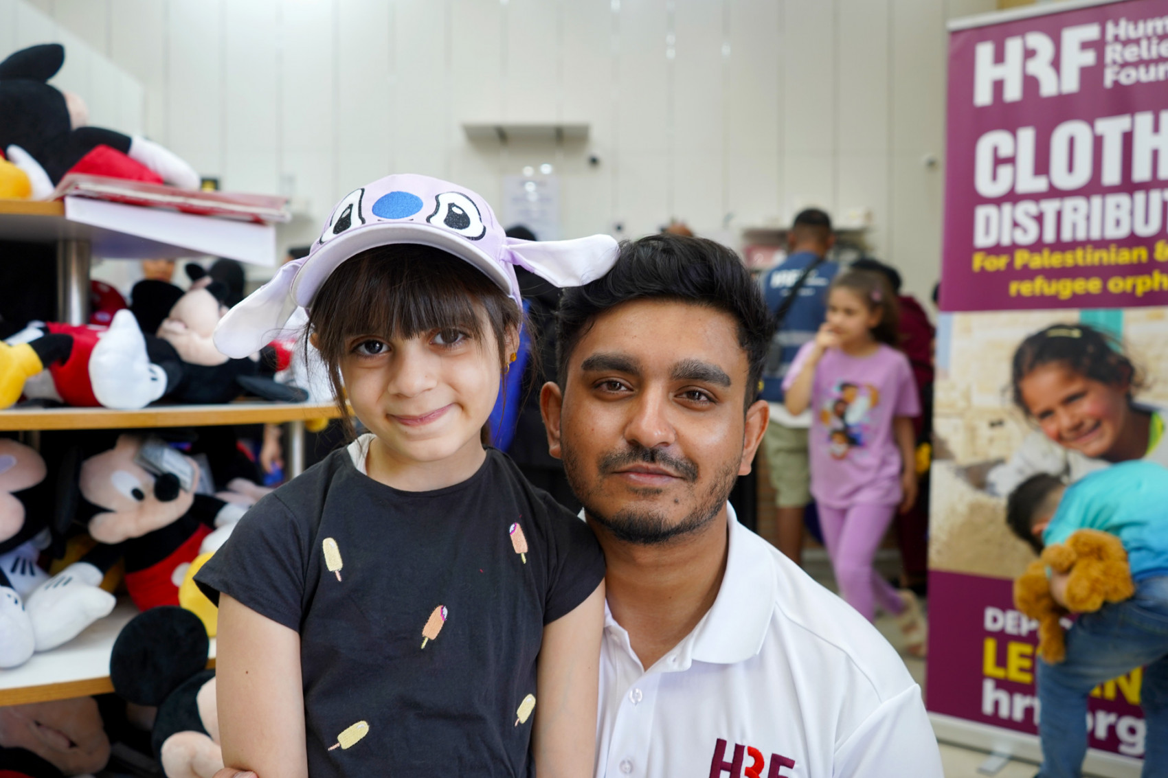 HRF fundraising coordinator for the North, Mohammed Talhah delivering Eid gifts to Syrian refugee children.
