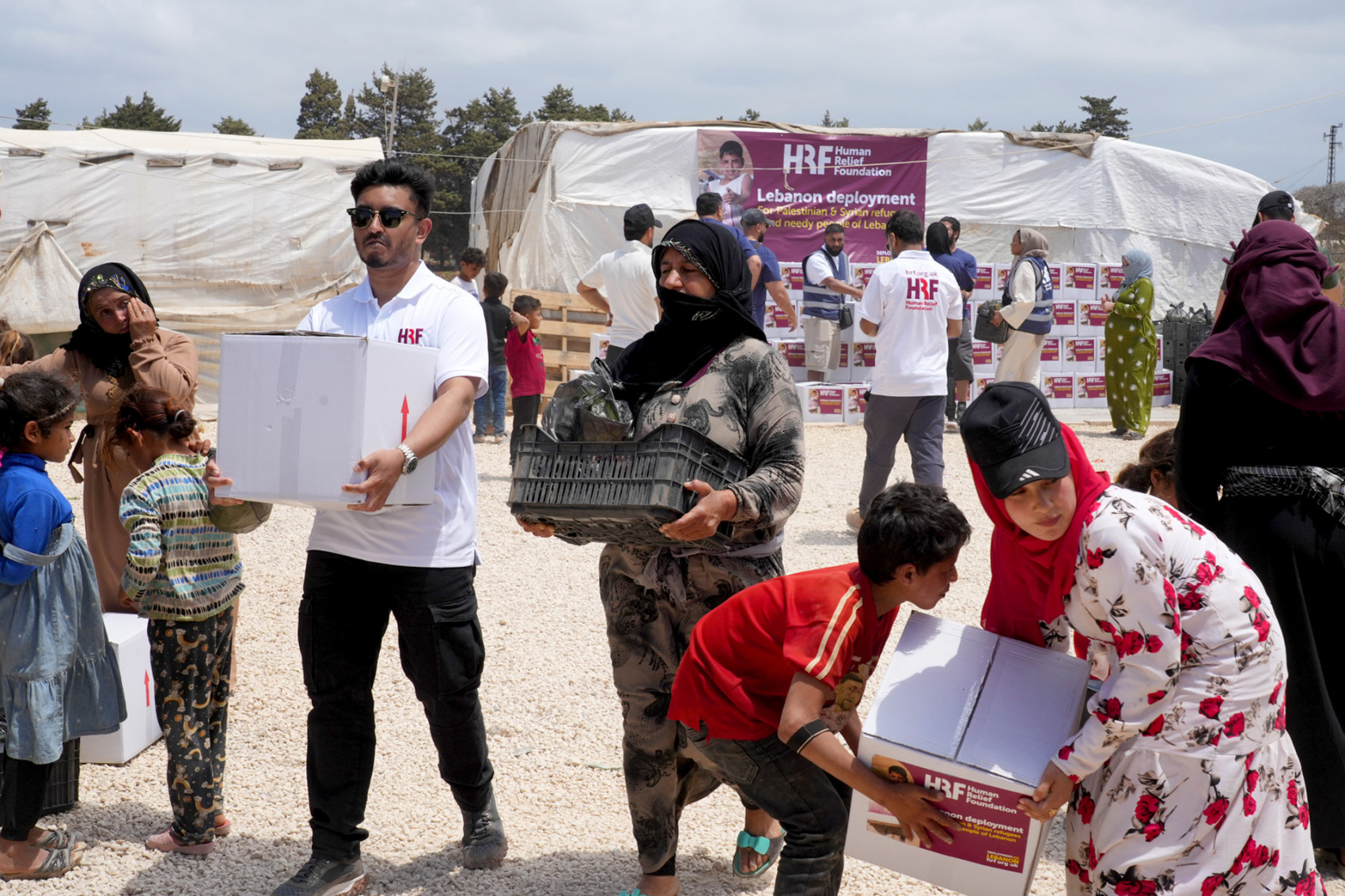 Mohammed Talhah assisting in the delivery of food aid at a Syrian refugee camp in Lebanon.